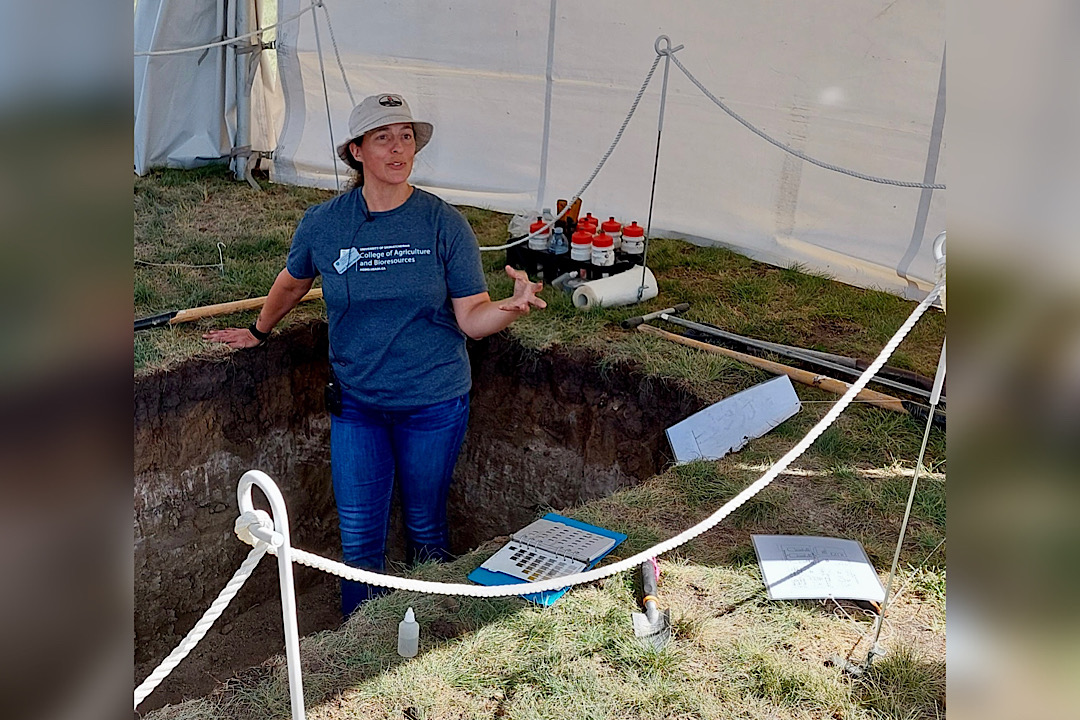 Dr. Angela Bedard-Haughn (PhD), dean of the College of Agriculture and Bioresources at the University of Saskatchewan (USask), leads a presentation in the soil pit at the college’s booth at Ag in Motion 2022. (Photo: Submitted)
