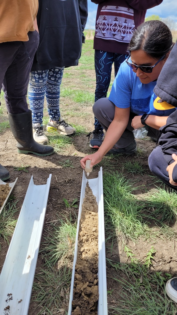 Soil cores being tested by a person - Muskeg Lake Cree Nation Garden Workshop