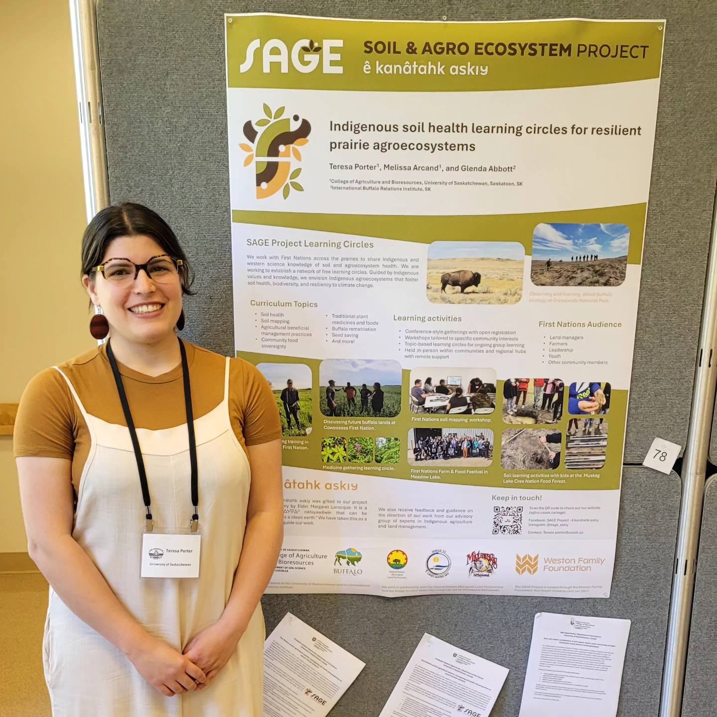 Teresa standing in front of a poster presentation