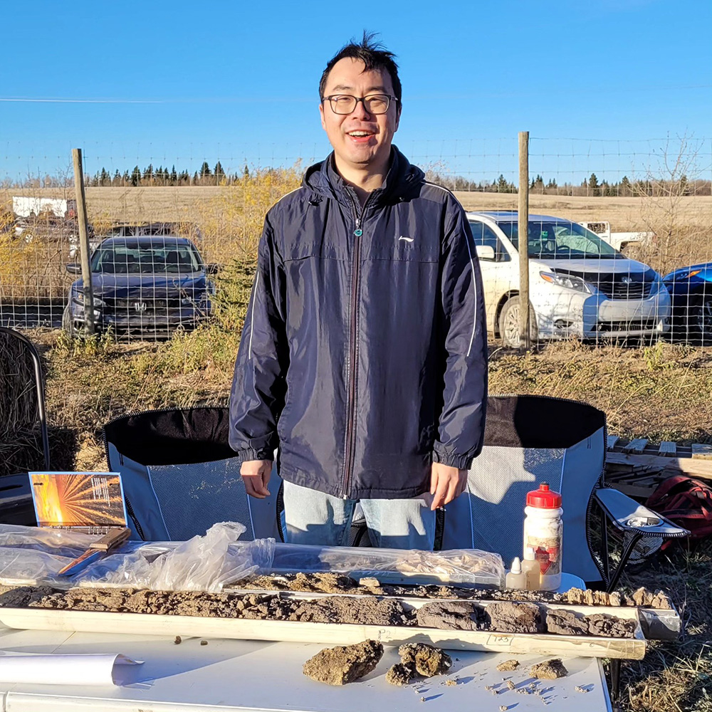 Harvest Science Fest at the Muskeg Lake Cree Nation Food Forest - Soil Core and Person