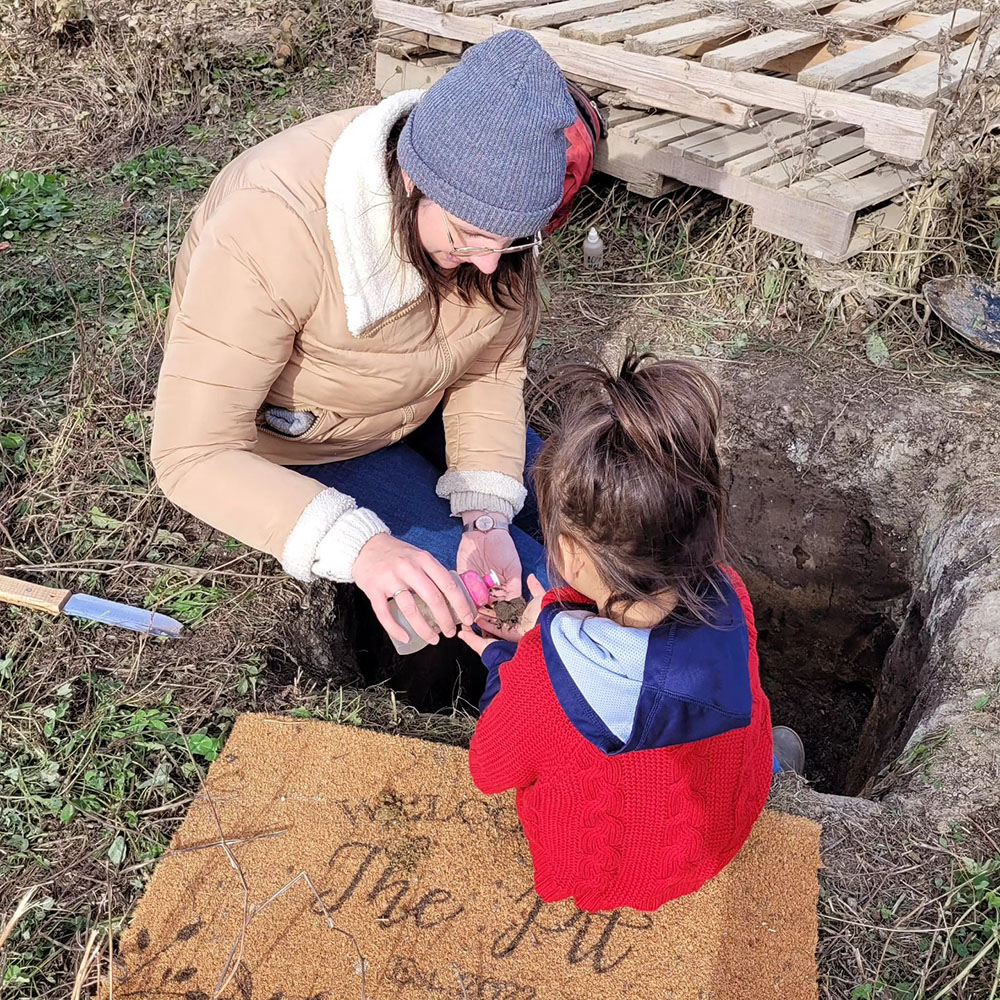 Harvest Science Fest at the Muskeg Lake Cree Nation Food Forest - Soil Pit with Person and Child