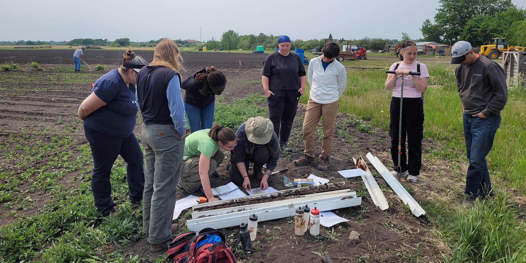 People outside learning about soils